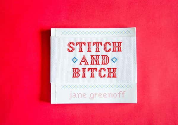 Krystal Loh - Cross stitched text reads Stitch and bitch