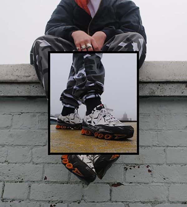 Caitlin Brown - Image of someones feet wearing street trainers, in a black frame, overlaid on the same person with same trainers sitting on a high wall
