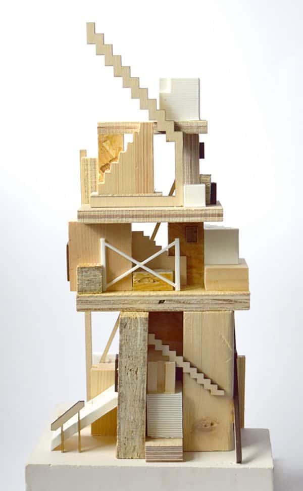 Alec Hawkins - A narrow wooden structure of a building with steep staircases