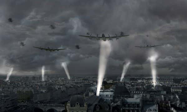 Joshua Garner - computer generated image shows expansive grey city with spotlights shining into the clouds and large bomber planes flying over