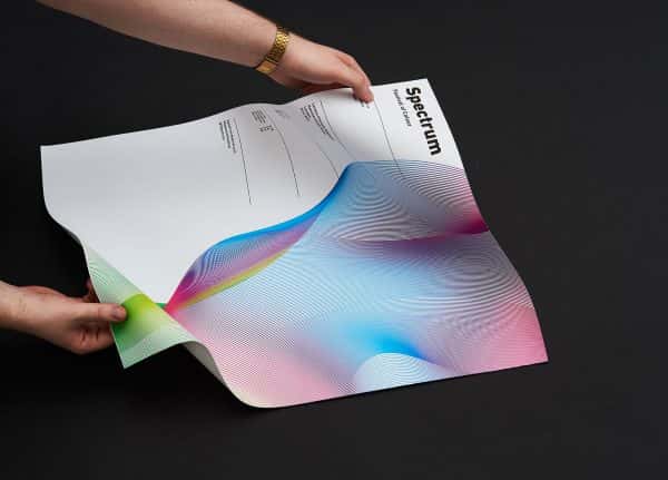 Dan Harrington - Image of a piece of design for publishing being held by hands
