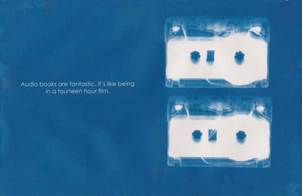 Amy Fellows - poster with blurry blue background, two audio cassettes in cyanotype style blurry white print fill the right hand side, text on the left reads Audio books are fantastic, it's like being in a fourteen hour film