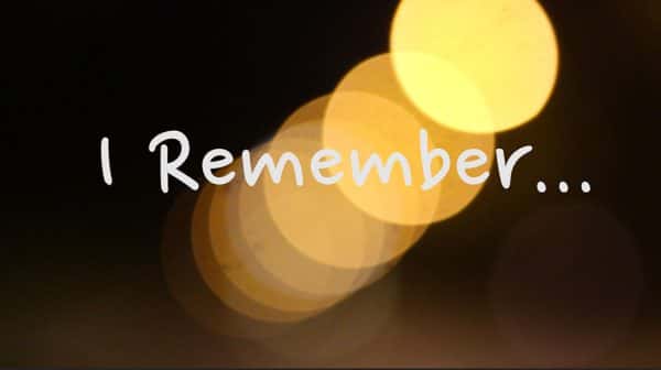 Emma Bates - White script style type says I remember... over a background of refracted warm yellow dots of light