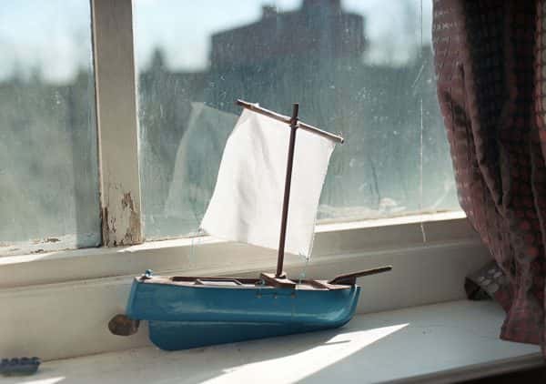 Karim Skalli - Small toy boat on a windowsill in the sun