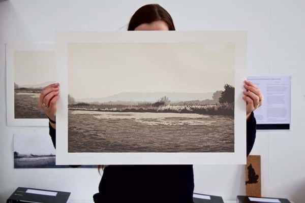 Lauren Brunt - Photo of a barren landscape held up by student