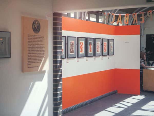 Norwich Arts Centre - Image of an internal gallery space featuring an exhibition of paperback word and orange work
