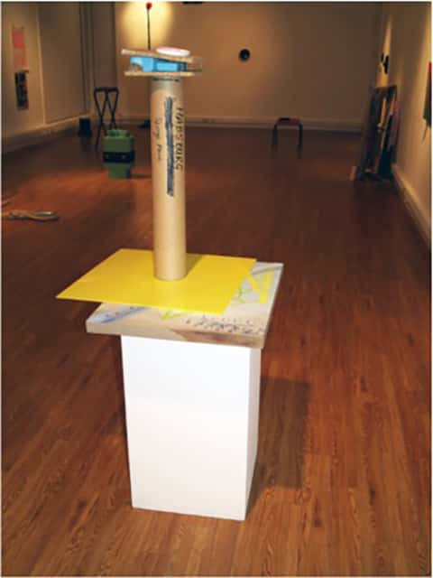 Habsburg Conversation 1, 2011 - Sculpture made from a cardboard tube and small and larger squares placed on a white rectangular plinth