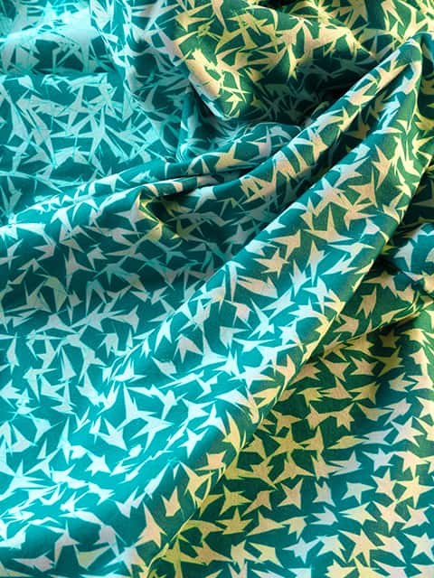 I used to be a star (detail) - Close up of ruched fabric in a mid green colour with white asymmetrical star pattern