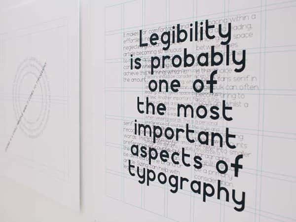 MA Communication Design - An image of large typed words mounted onto white graph paper