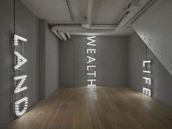  - LED word display saying Wealth, Land, Life, by Nathan Coley.