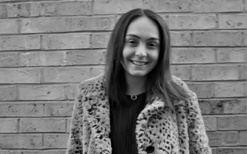 A black and white photograph of BA Fashion student Emily Saunders