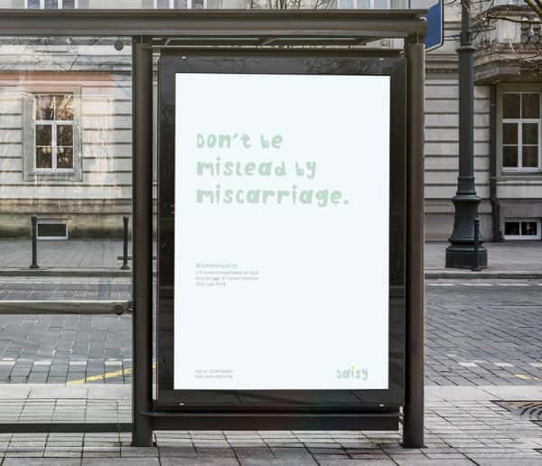 Corrina Mark - Bus shelter poster design raising awareness for miscarriages, by BA Graphic Communication student Corrina Mark. A white poster with pale mint green writing saying 'Don't be mislead by miscarriage'