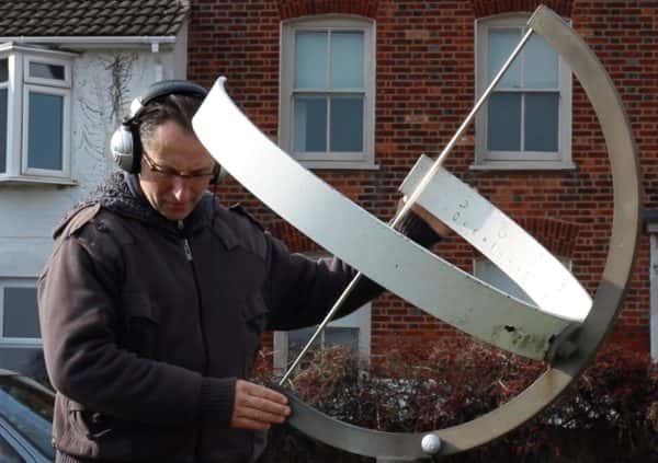 Jamie Gledhill - Jamie adjusting a large metal sundial