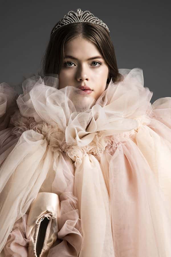 Alice Hampton - Model wears a jeweled tiara, and layers of ruched pink fabric