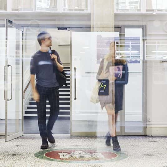  Image showing to people in foyer of building carrying bags