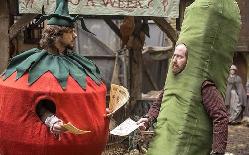 Screen shot from BBC Film Bill showing 2 characters wearing a tomato and cucumber outfit handing out flyers