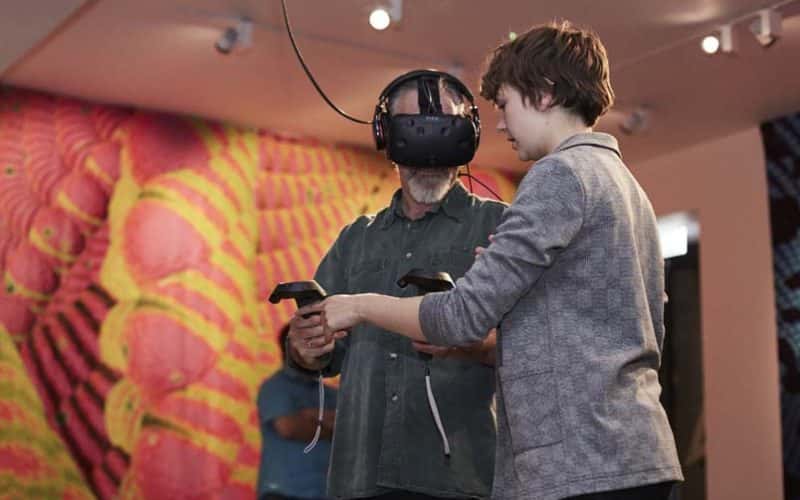 Image of two people using a VR headset