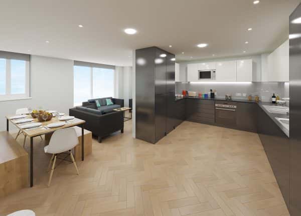 Kitchen - A kitchen diner communal area in the St Crispins student accommodation. The dining area is modern and the large kitchen is gloss black with granite worktops